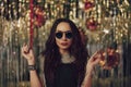 Attractive hipster girl holding sparklers in hands Royalty Free Stock Photo