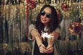 Attractive hipster girl holding sparklers in hands Royalty Free Stock Photo