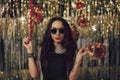 Attractive hipster girl holding sparklers in hands Royalty Free Stock Photo