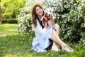 Attractive hipster young woman went for a walk in the park, playing with cute jack russell terrier puppy on clear sunny day. Royalty Free Stock Photo