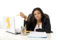 Attractive hispanic businesswoman or secretary suffering breakdown and headache in stress at office Royalty Free Stock Photo