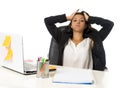 Attractive hispanic businesswoman or secretary suffering breakdown and headache in stress at office Royalty Free Stock Photo