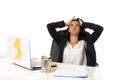 Attractive hispanic businesswoman or secretary suffering breakdown and headache in stress at office Royalty Free Stock Photo