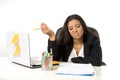 Attractive hispanic businesswoman or secretary suffering breakdown and headache in stress at office Royalty Free Stock Photo