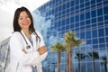 Attractive Hispanic Doctor or Nurse in Front of Building Royalty Free Stock Photo