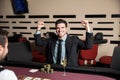 Excited man winning at poker Royalty Free Stock Photo