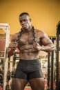 Attractive hunky black male bodybuilder posing