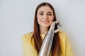 Attractive lady with bionic prosthesis arm looks into camera