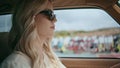 Attractive lady driver riding auto in sunglasses closeup. Girl driving highway Royalty Free Stock Photo