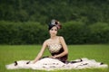 Attractive lady in formal gown at park Royalty Free Stock Photo