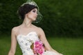 Attractive lady in formal gown in the park Royalty Free Stock Photo