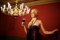Attractive lady with a glass of red wine.