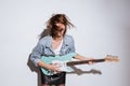 Attractive lady holding guitar over white background Royalty Free Stock Photo