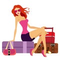 Attractive lady sitting on suitcases.