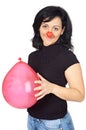 Attractive lady whit clown nose and a globe