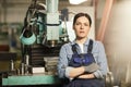 Attractive lathe worker in overalls