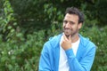 Attractive latin guy looking at camera in a park Royalty Free Stock Photo