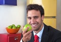 Attractive latin man eating an apple Royalty Free Stock Photo