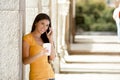 Attractive latin woman on her smart phone Royalty Free Stock Photo