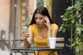 Attractive latin woman shocked on her smart phone Royalty Free Stock Photo