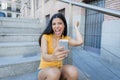 Attractive latin woman listening to music on her smart phone Royalty Free Stock Photo