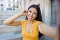 Attractive latin woman listening to music on her smart phone Royalty Free Stock Photo