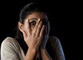 Attractive Latin woman scared terrorized and horrified covering her eyes Royalty Free Stock Photo