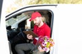 Delivery man checking the shipping address of a client Royalty Free Stock Photo