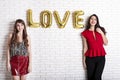 Same sex love concept. Two beautiful females women girls from lgbt community with long gorgeous hair on February 14th Happy valent Royalty Free Stock Photo