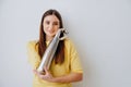 Attractive lady with bionic prosthesis arm looks into camera