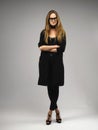 Attractive long legs long hair model woman wearing geeky glasses Royalty Free Stock Photo
