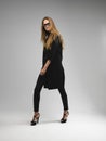 Attractive long legs long hair model woman wearing geeky glasses Royalty Free Stock Photo