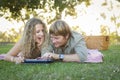 Attractive Loving Couple Using a Touch Pad Outside