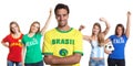 Attractive man from Brazil with four female sports fans Royalty Free Stock Photo