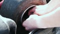 Attractive man checking tire pressure on his gocart