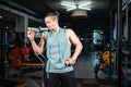 young handsome athlete hungry and eating healthy apple fruit in gym Royalty Free Stock Photo