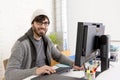 Attractive man hipster trendy style businessman working home office with desktop computer Royalty Free Stock Photo