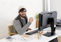 Attractive man hipster trendy style businessman working home office with desktop computer Royalty Free Stock Photo