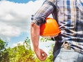 Attractive man holding construction helmet in his hands Royalty Free Stock Photo