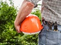 Attractive man holding construction helmet in his hands Royalty Free Stock Photo