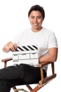 Attractive man holding a film slate