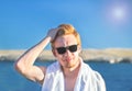 Attractive man with protective sun cream & x28;solar cream, sunscreen& x29;  on the face for care of his body. Young handsome male Royalty Free Stock Photo