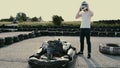 Attractive man putting on a helmet before getting into his gocart