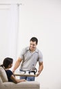 Attractive man serving a tray of food to a woman. Royalty Free Stock Photo