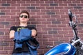 Attractive Man in Shades with Jacket and Motorbike Royalty Free Stock Photo