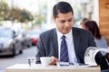 Attractive man with suit is resting in cafe Royalty Free Stock Photo