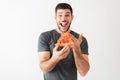 Attractive man taking a bite of a tasty slice of pizza Royalty Free Stock Photo