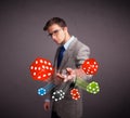 Attractive man throwing dices and chips Royalty Free Stock Photo