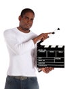 Attractive man using clapperboard