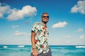 Attractive man wearing hawaiian shirt at the sea or the ocean background Royalty Free Stock Photo